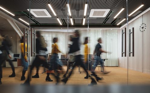 Busy office with people walking