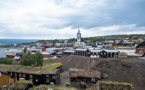 Old street architecture of mining town Roros in Norway. Wooden, colorful buildings. UNESCO world heritage list.